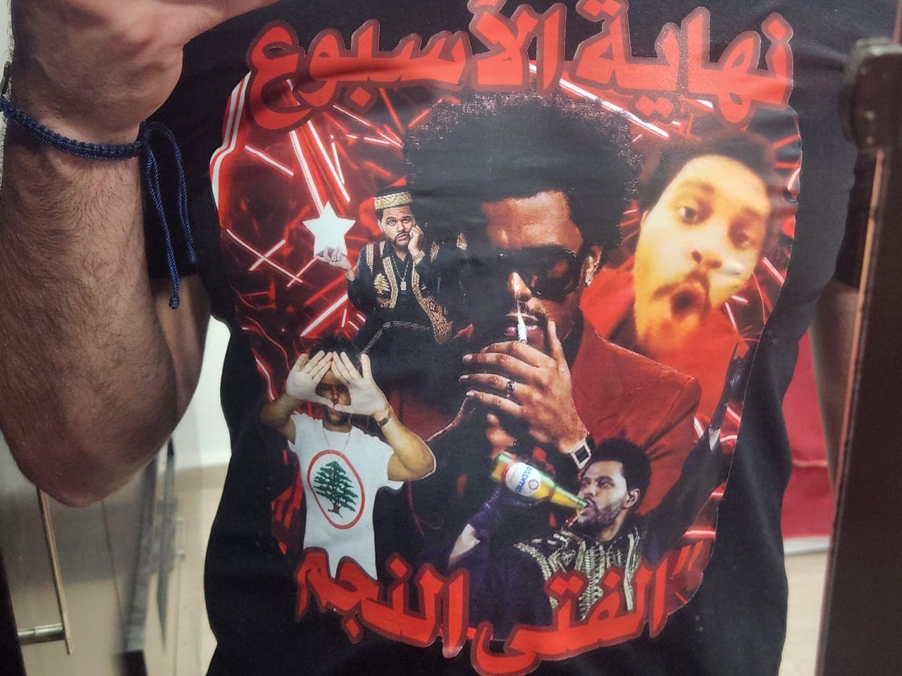 Customer photo of their Arabized Drip tee