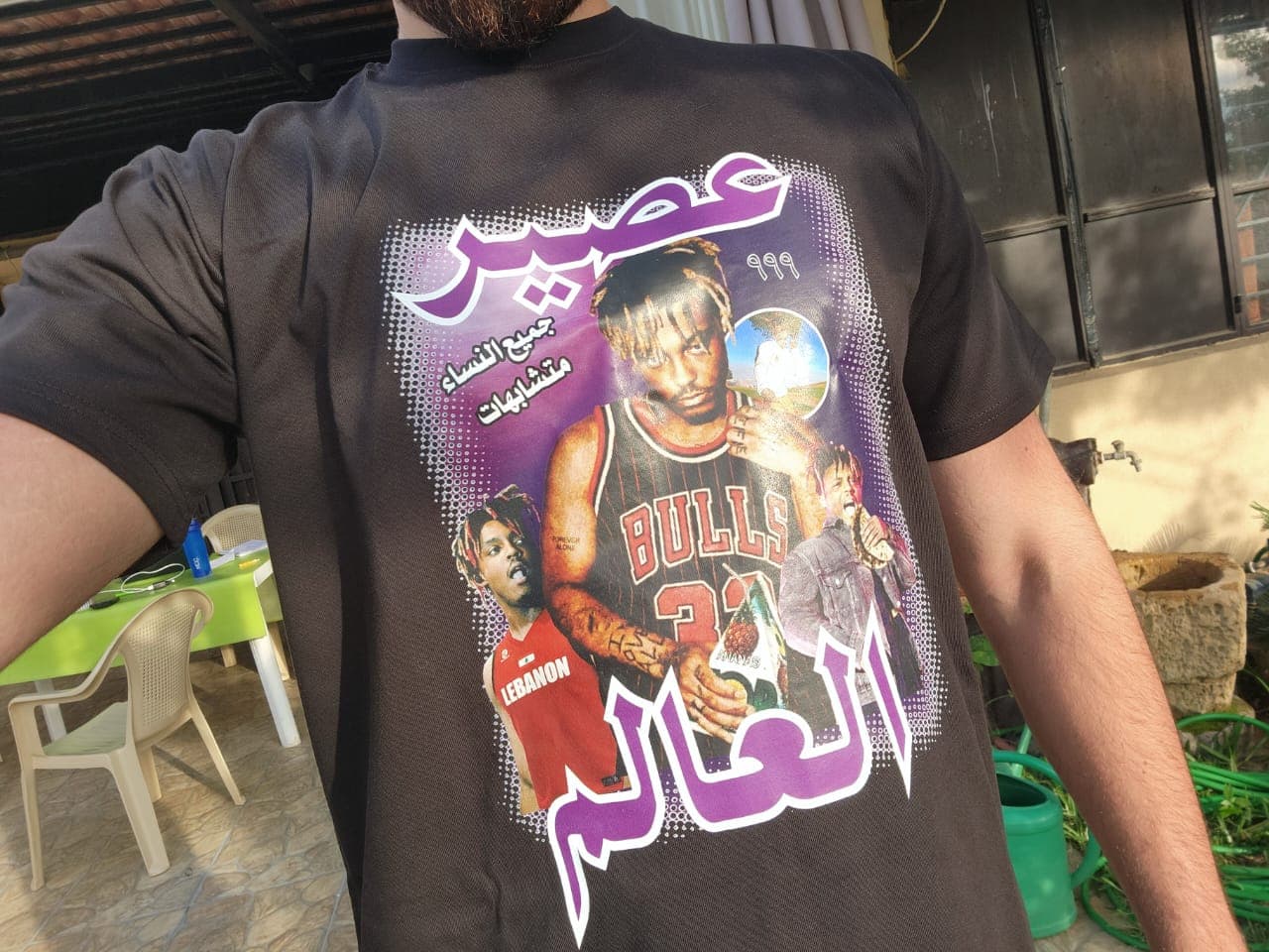 Customer wearing their Arabized Drip tee